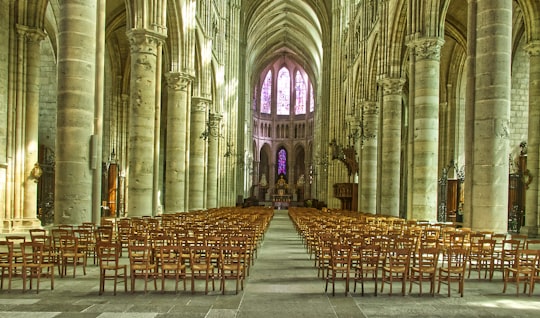 brown wooden chairs inside cathedral in Soissons Cathedral France