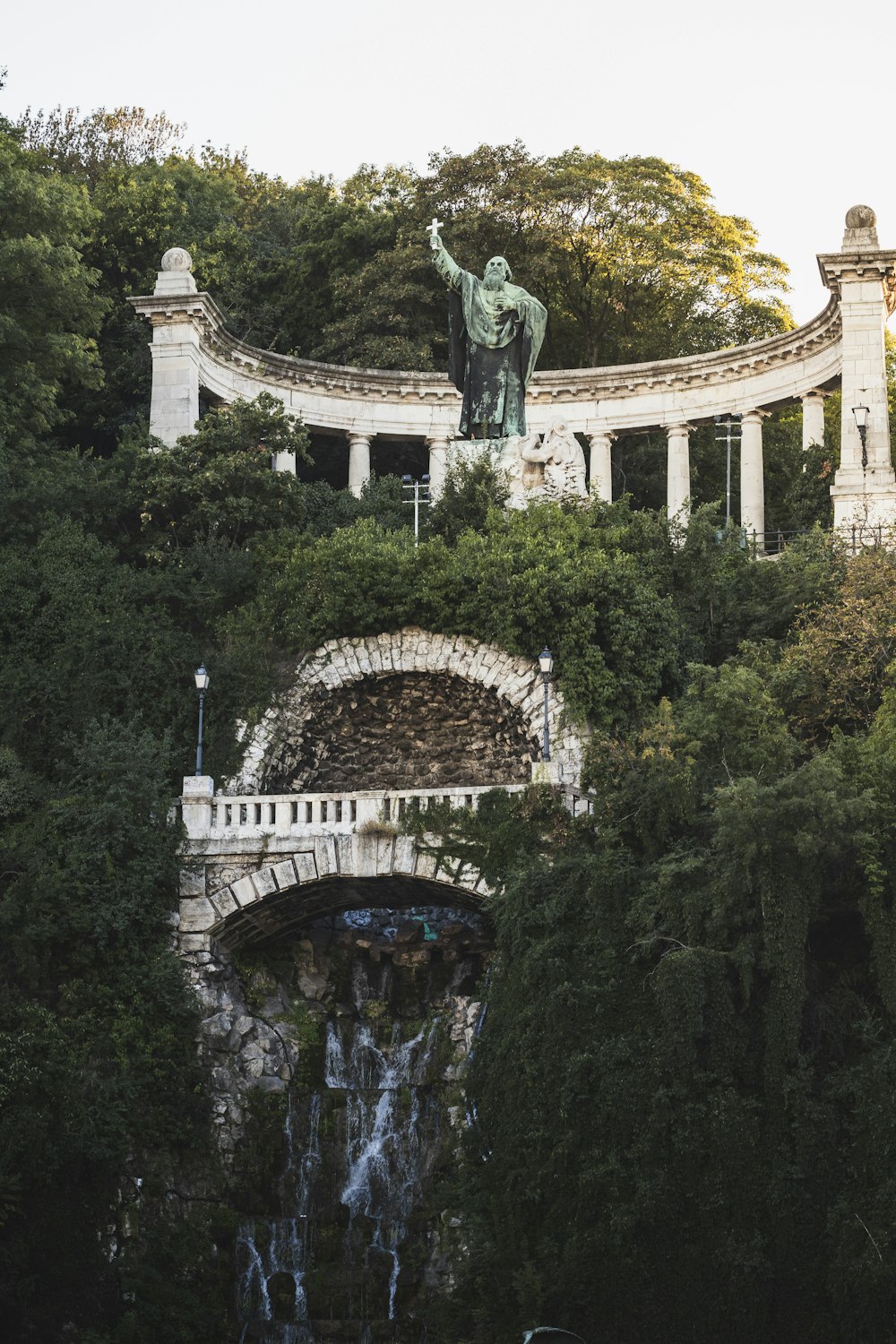 man statue on top of a building