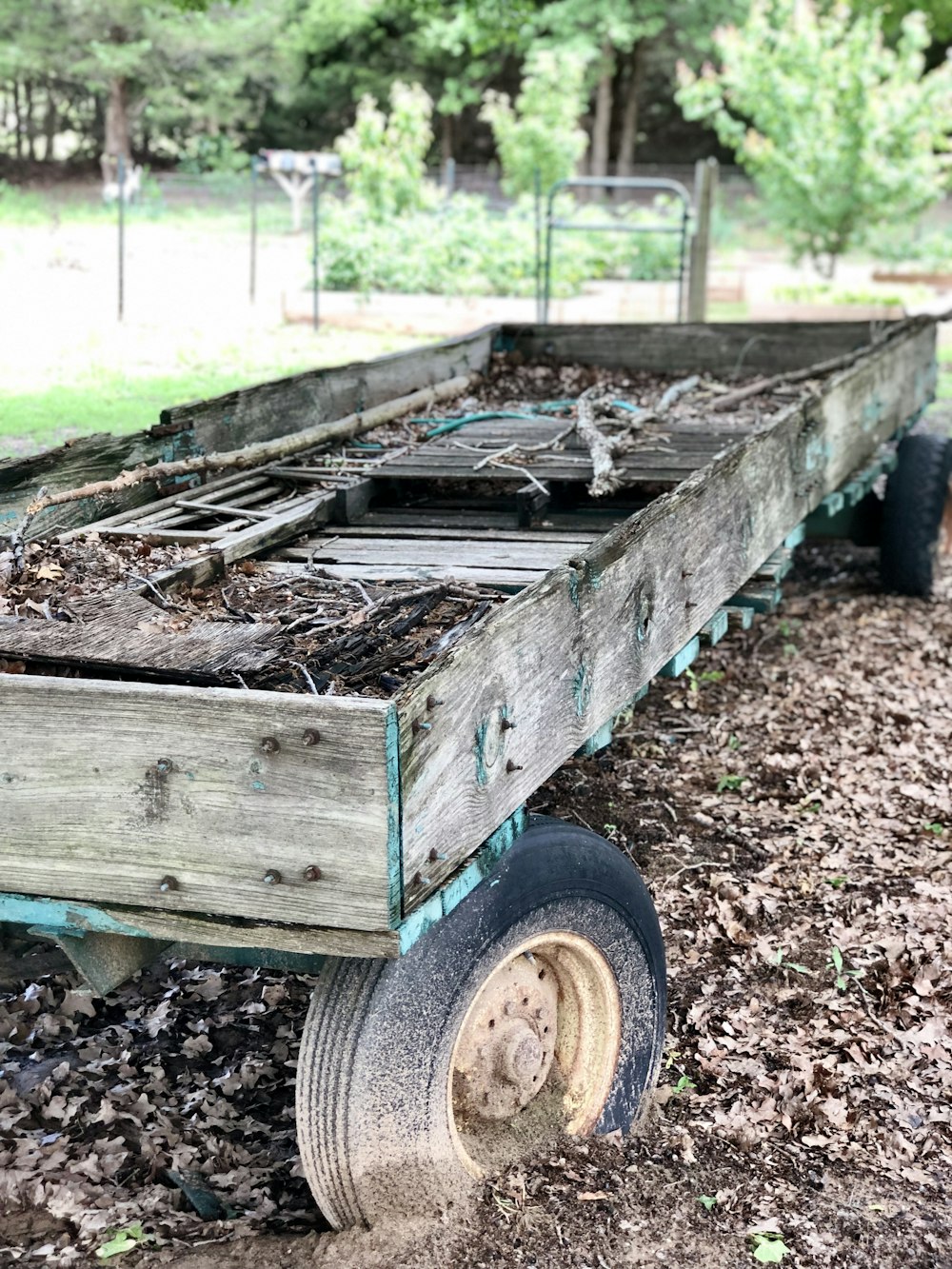 brown wooden trailer with firewood