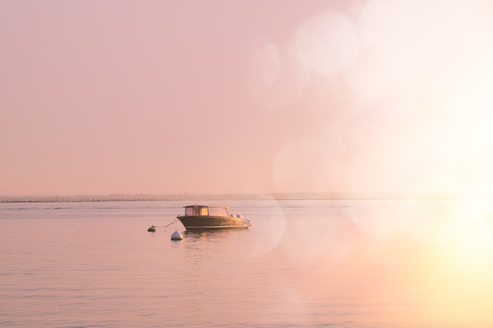 brown boat on body of water during daytime