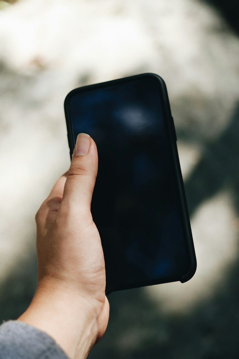 person holding black android smartphone