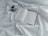 A close-up of an open book with handwritten notes and a cup of coffee beside it.