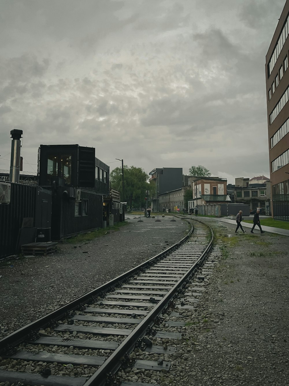 train rail near building during daytime