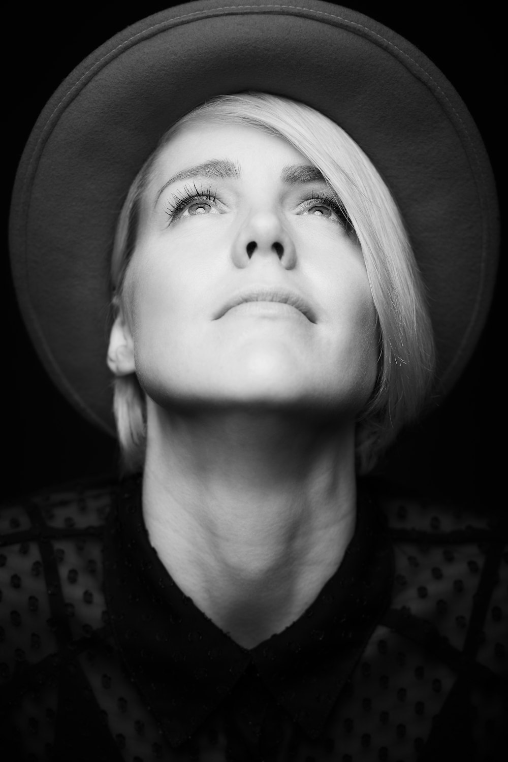 grayscale photo of girl wearing hat