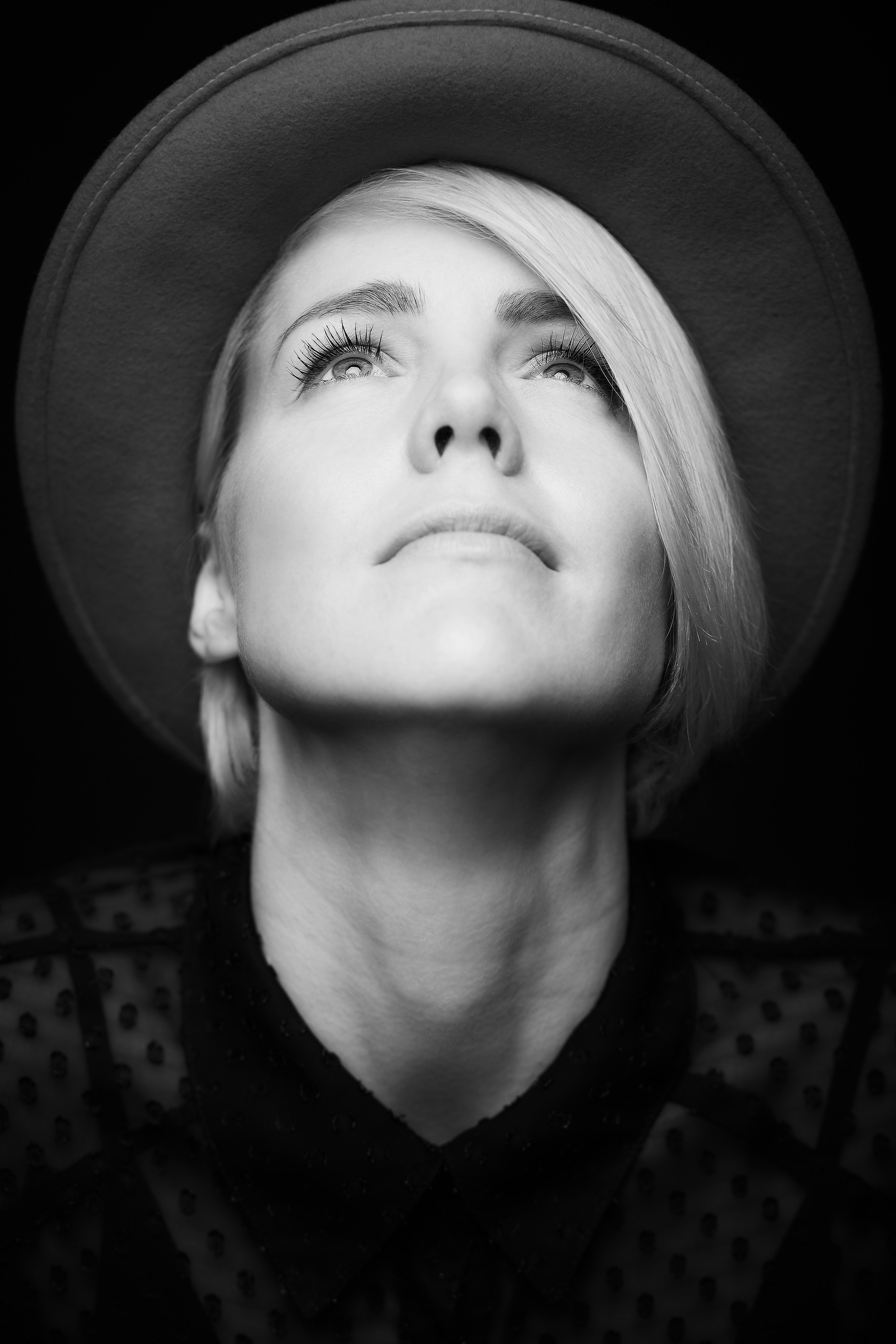 grayscale photo of girl wearing hat