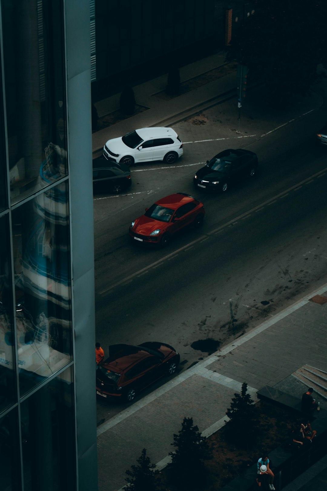 red and white cars on road during daytime