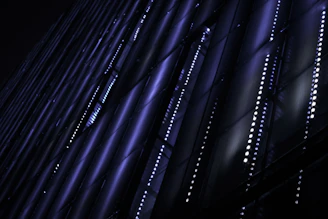 Futuristic dark-themed 3D grid with glowing blue and violet neon lines representing digital growth.