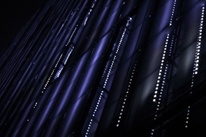 Midnight blue and neon gradient smart lockers connected by flowing data lines under a dynamic grid background.