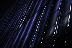 Abstract grid overlay with electric blue and metallic purple neon lines forming a secure network map.