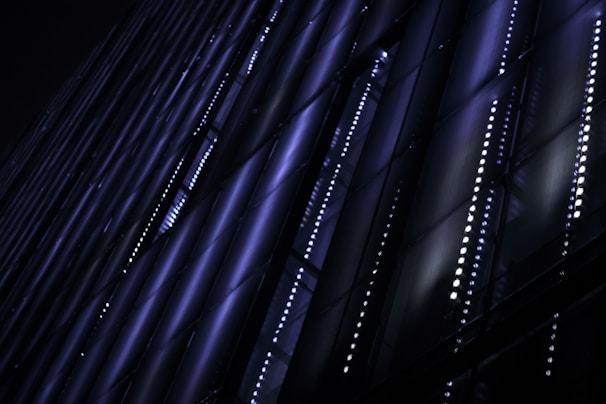 Futuristic glowing data grid with neon purple and electric blue accents representing business connections.