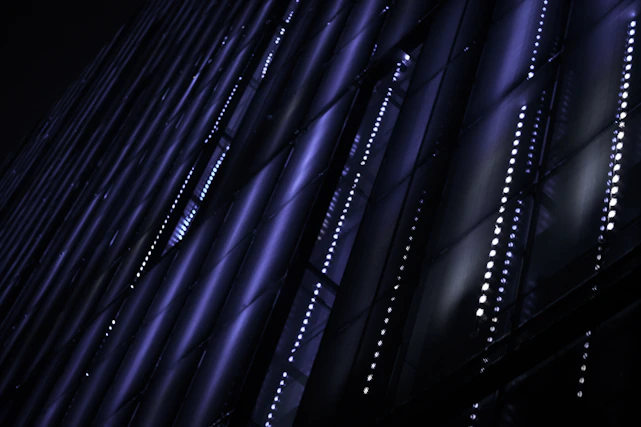 a sleek neon-blue glowing digital grid on a deep charcoal background