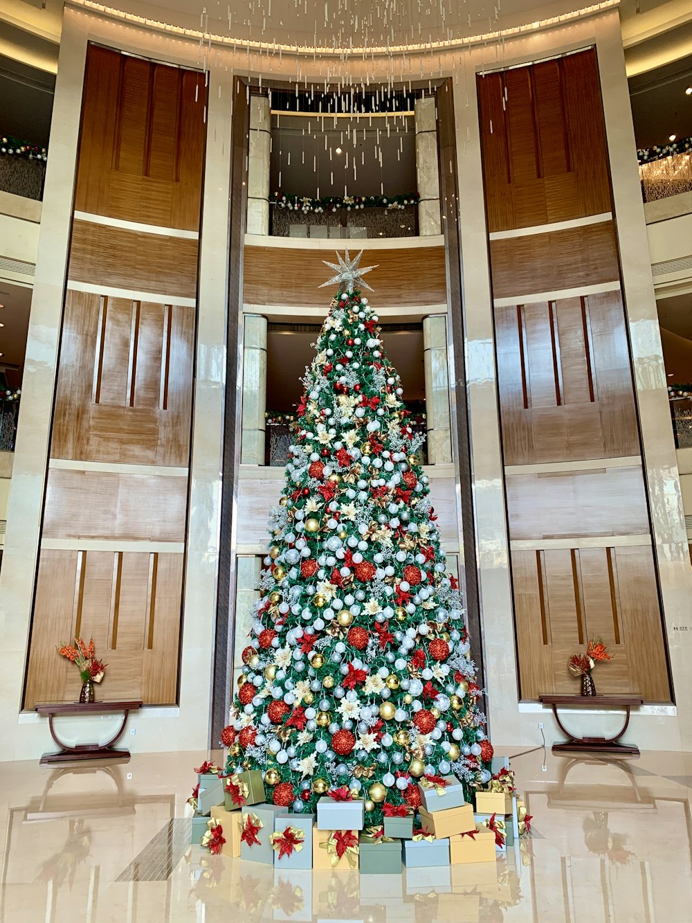 green christmas tree with red and white baubles