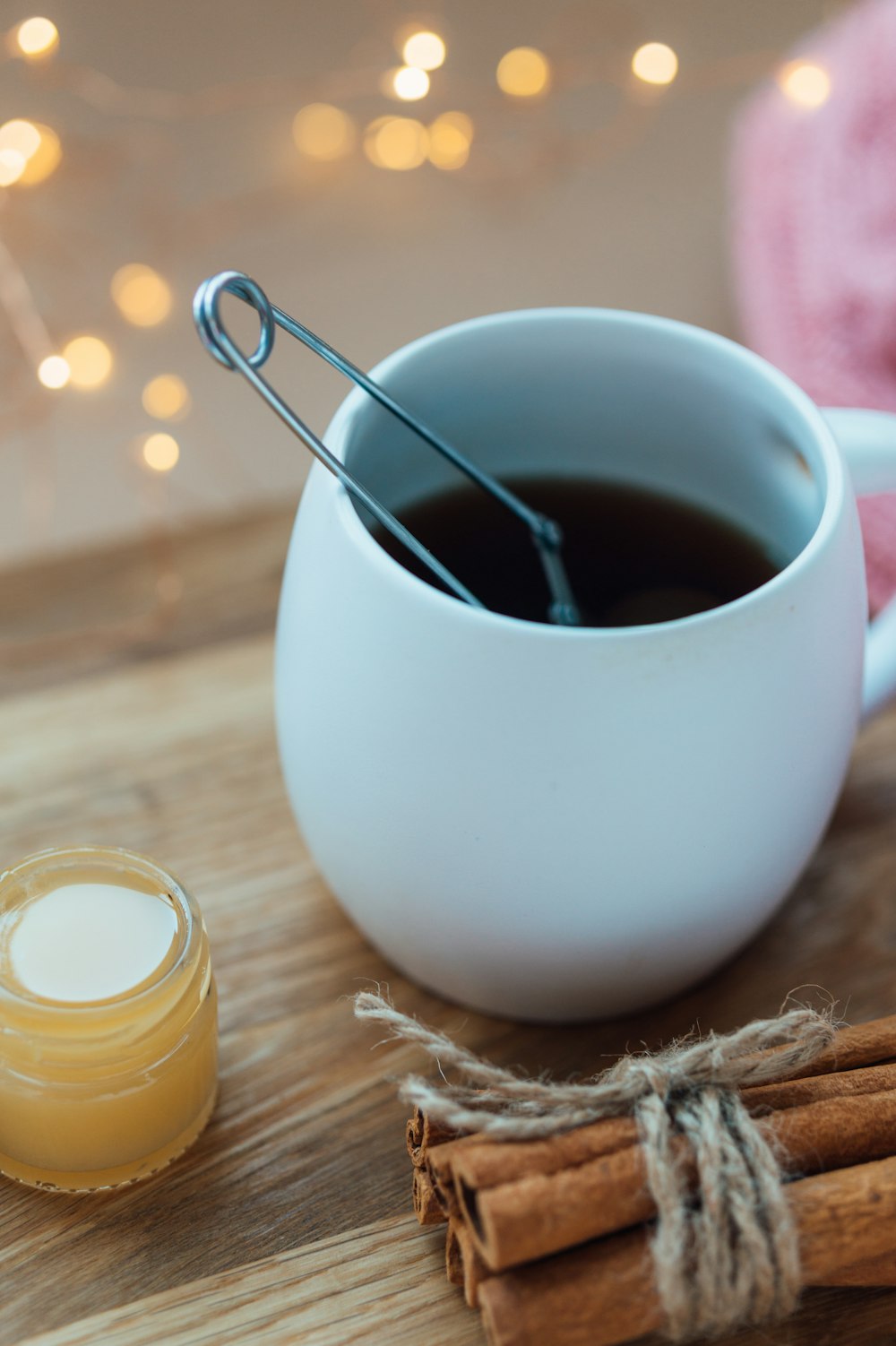 white ceramic mug with brown liquid inside