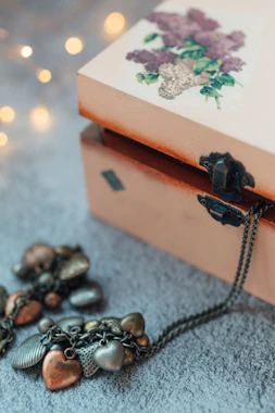 black and brown beaded necklace on brown box