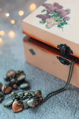 black and brown beaded necklace on brown box
