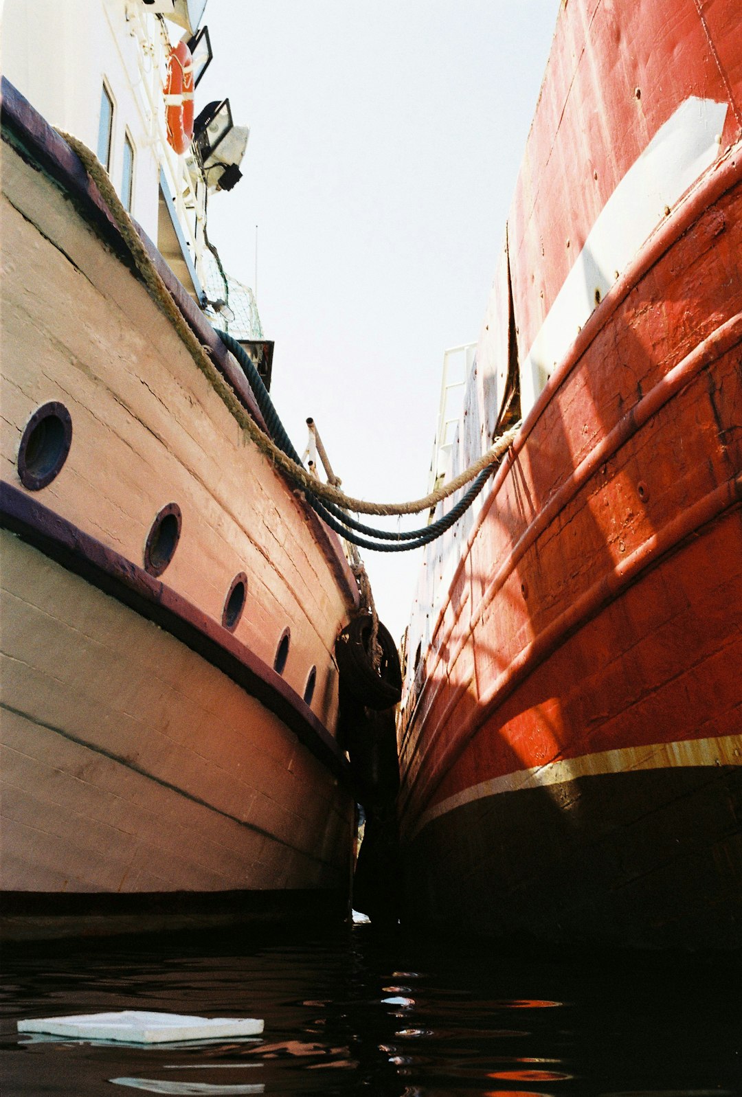 brown and white ship on sea during daytime