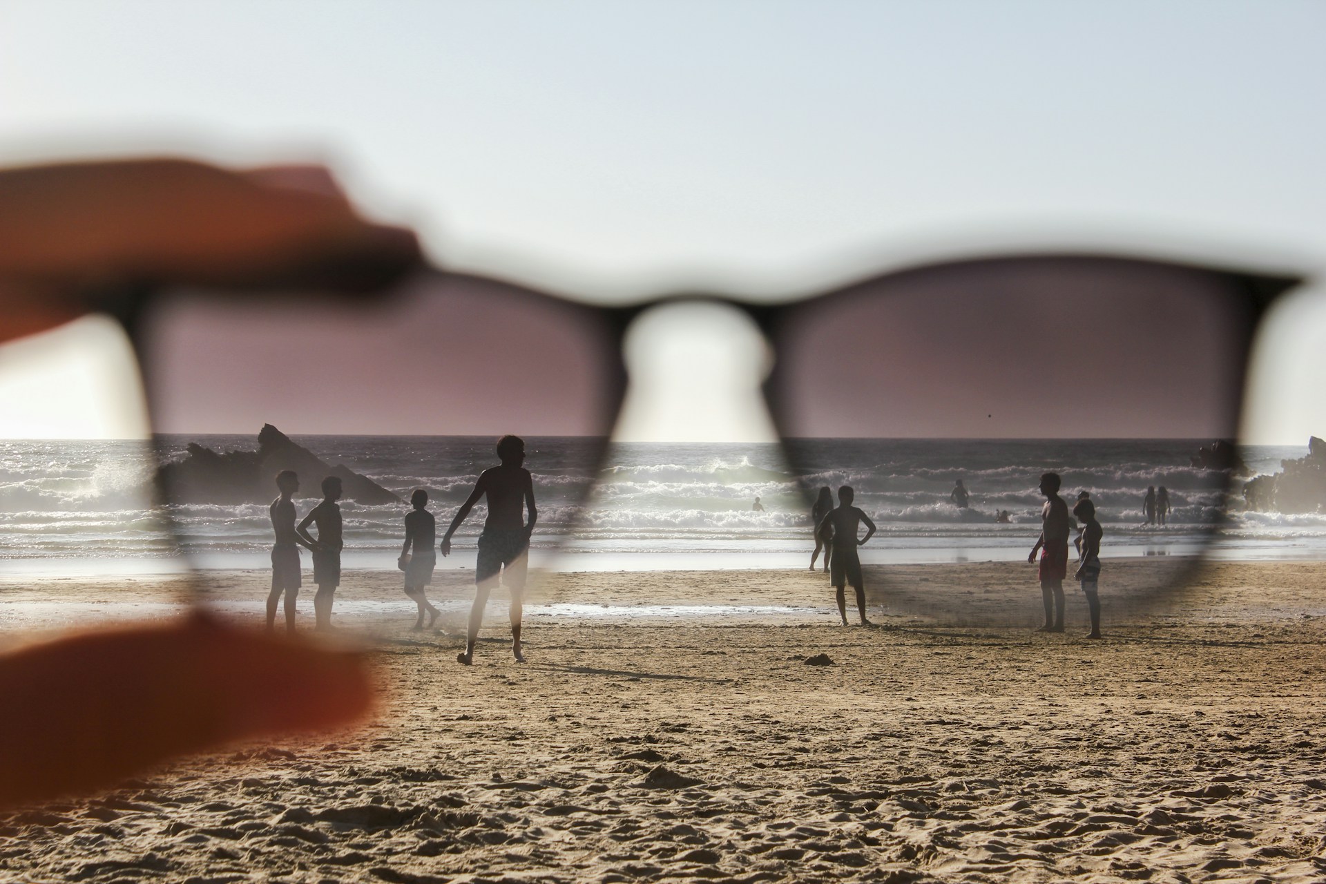 people on beach during sunset