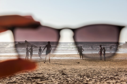 people on beach during sunset in Odeceixe Portugal