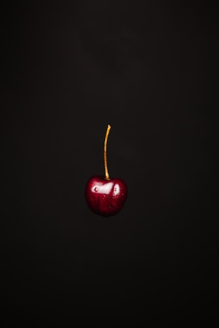 red apple with black background