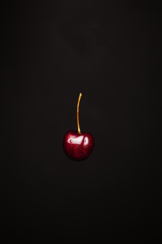 red apple with black background