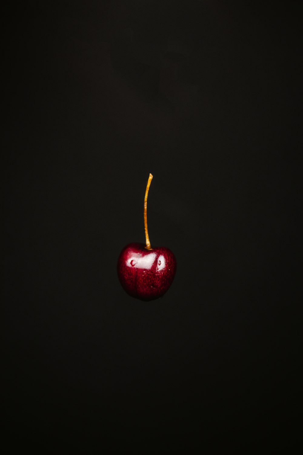 red apple with black background