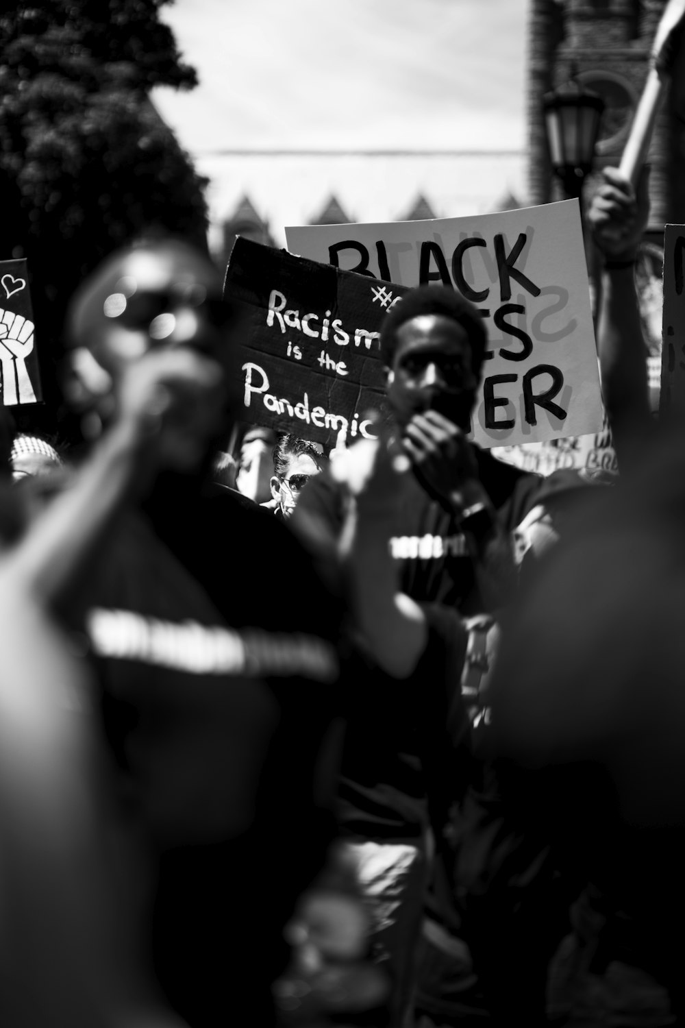 grayscale photo of man in black shirt