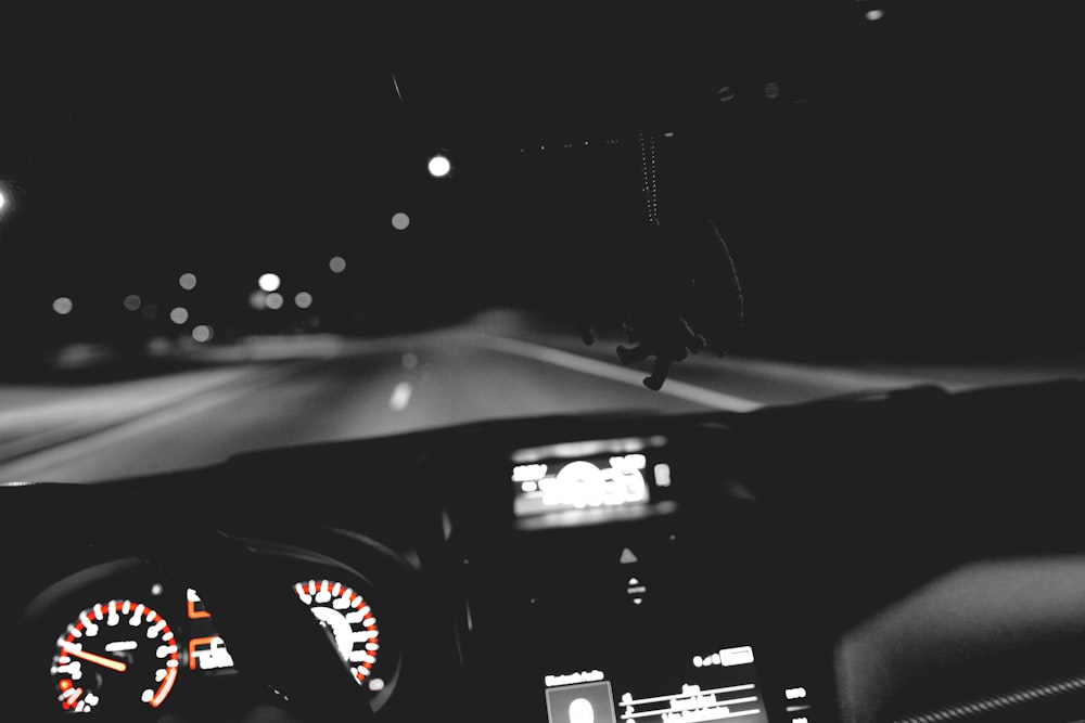 black car dashboard with water droplets