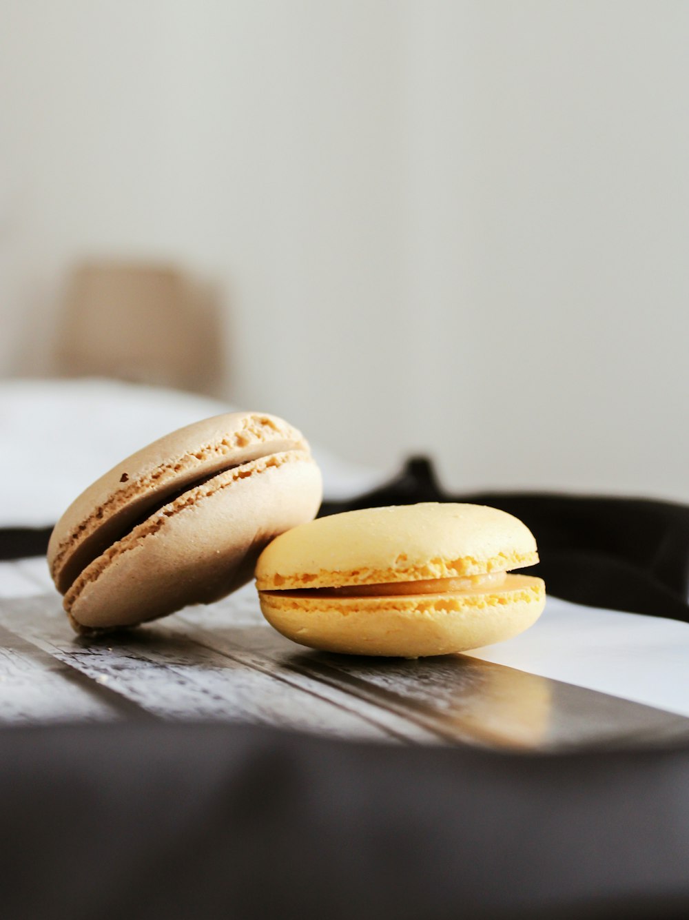 three brown cookies on white ceramic plate