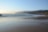 A serene landscape with gentle waves and soft light.