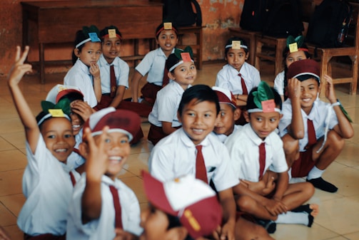 children wearing white school uniform