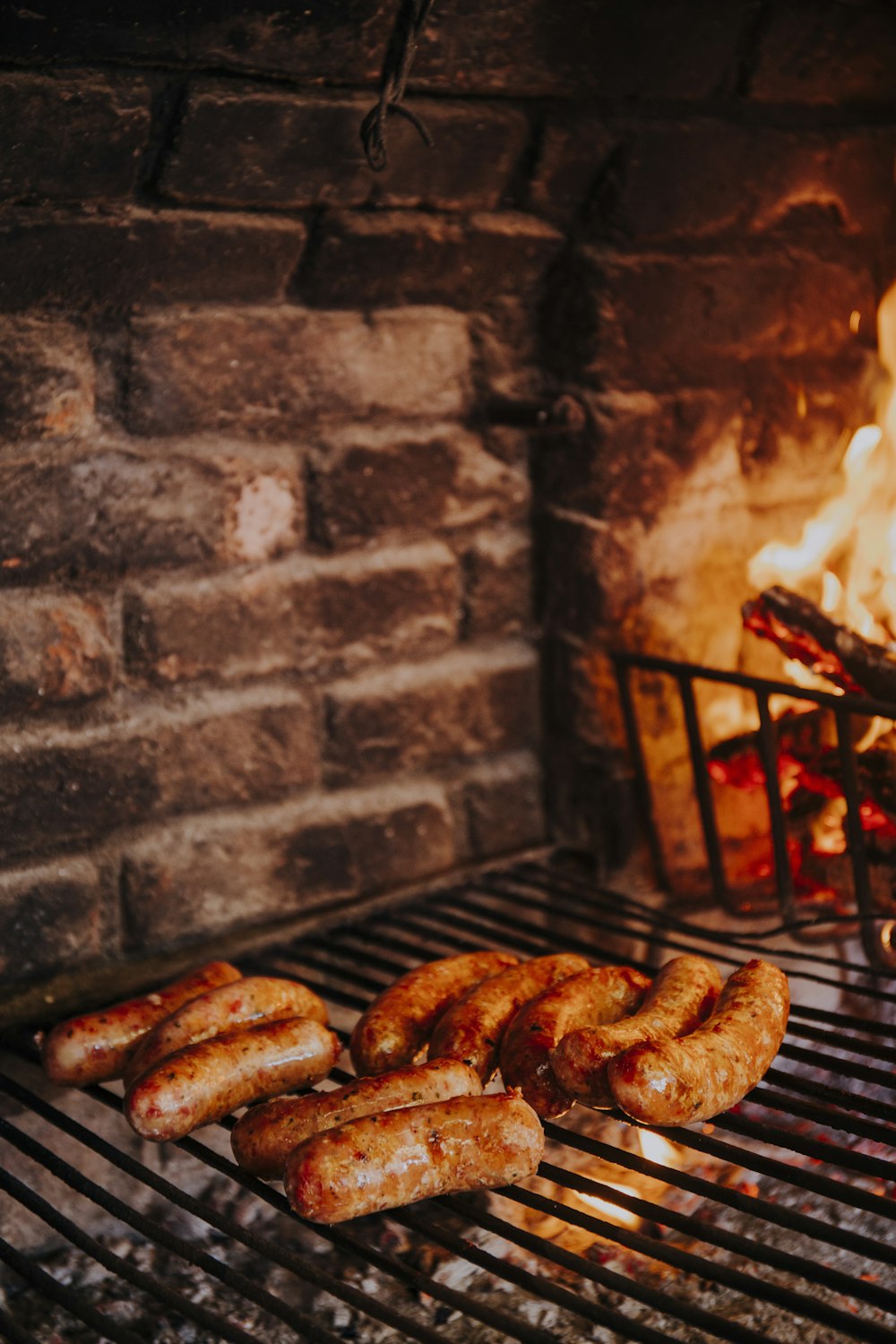 grilled sausage on charcoal grill