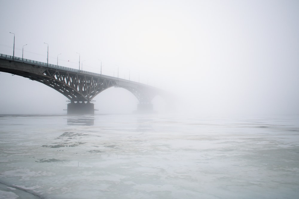 gray bridge over body of water