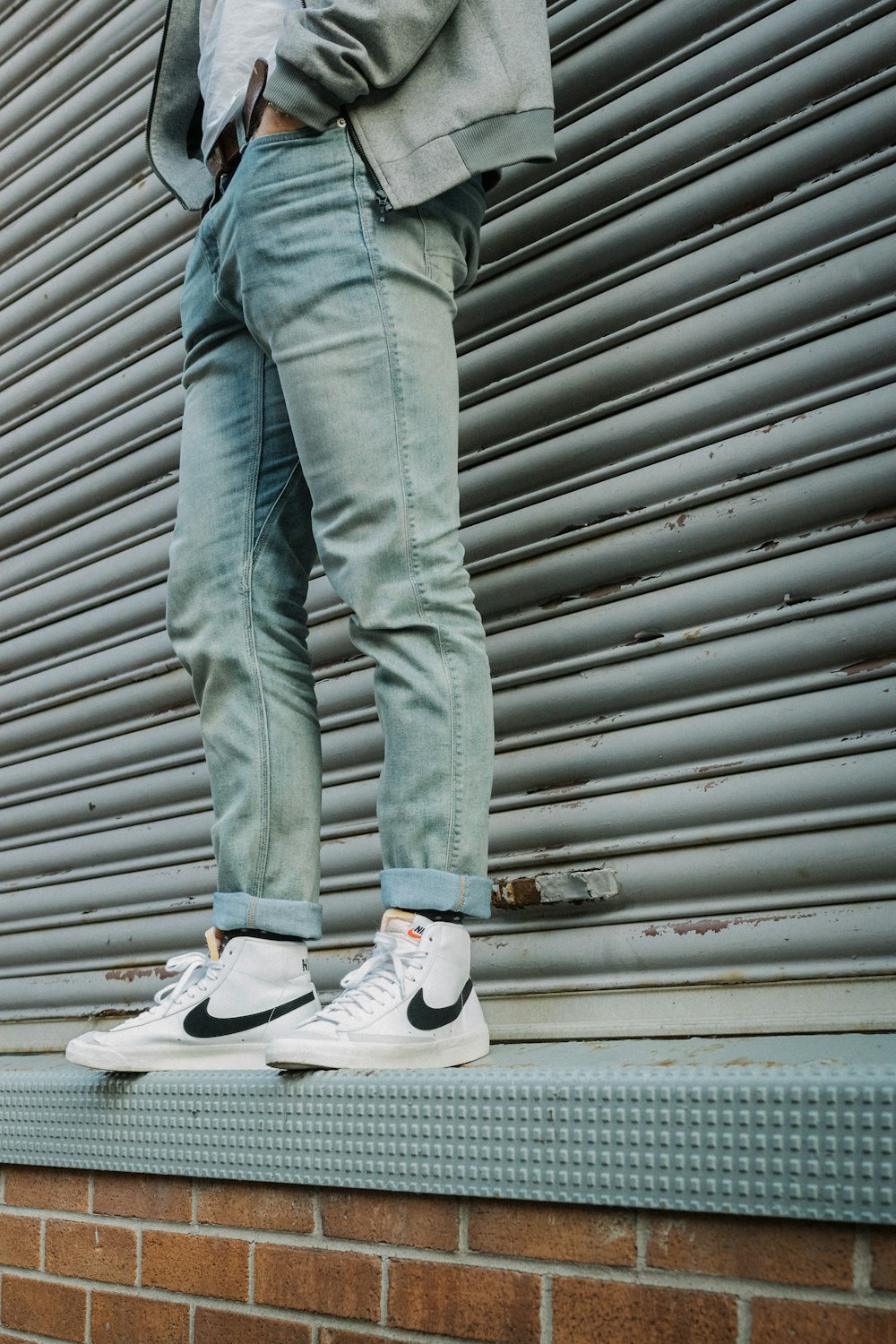 person in gray denim jeans and gray nike sneakers photo – Free Grey Image  on Unsplash
