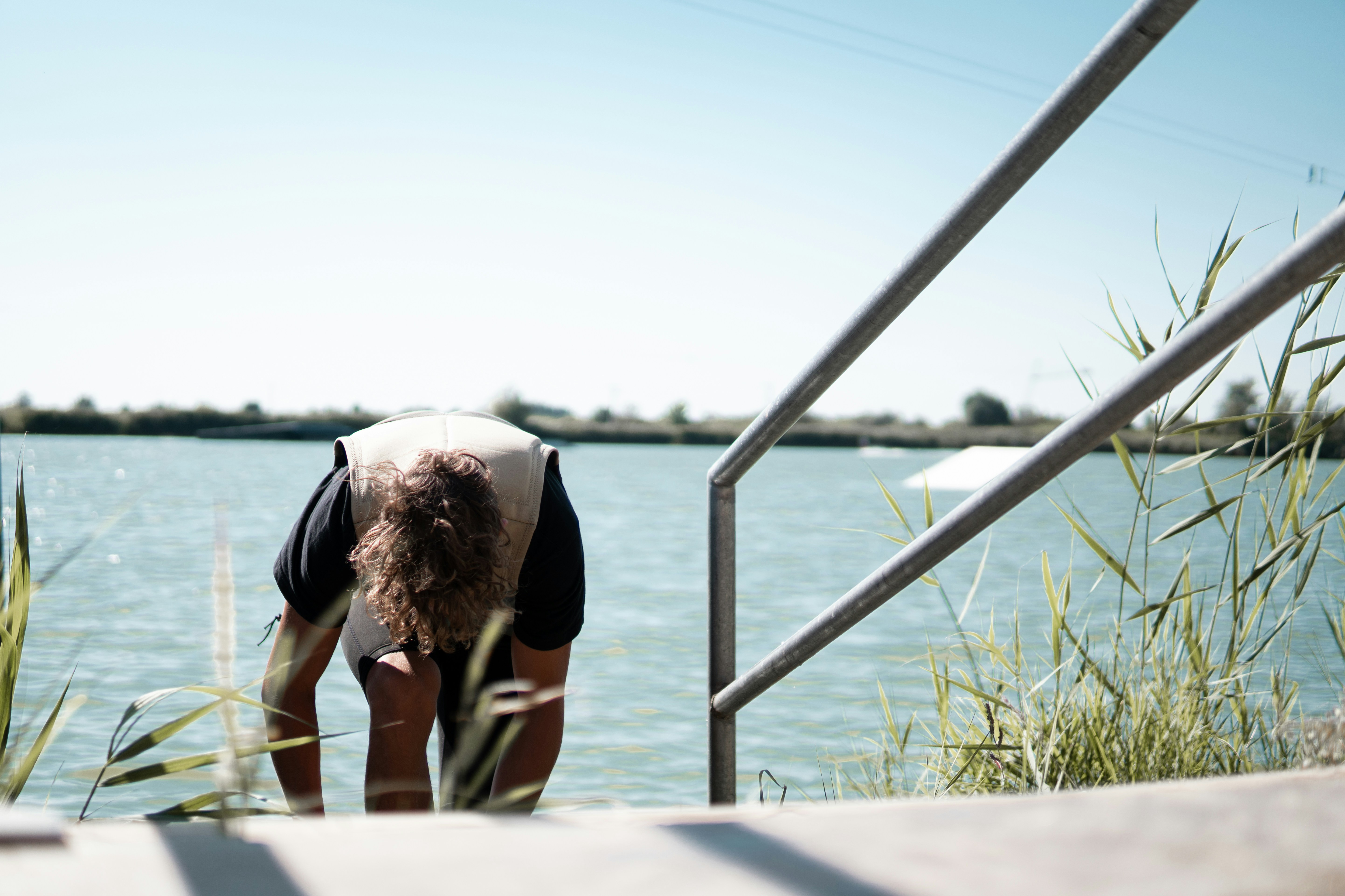 man in black t-shirt and black shorts standing beside woman in black t-shirt near near near near near