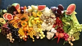sliced fruits on black plate