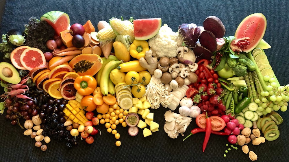 sliced fruits on black plate