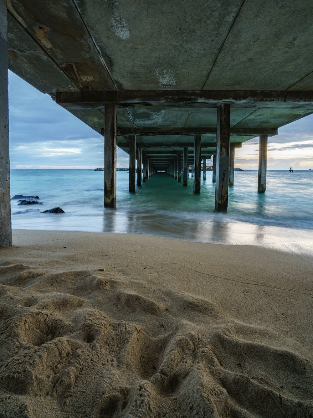 brown wooden dock on sea during daytime