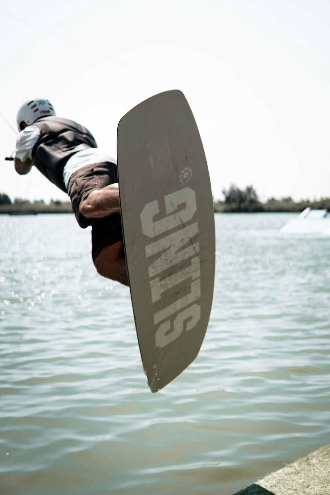 person holding white surfboard during daytime