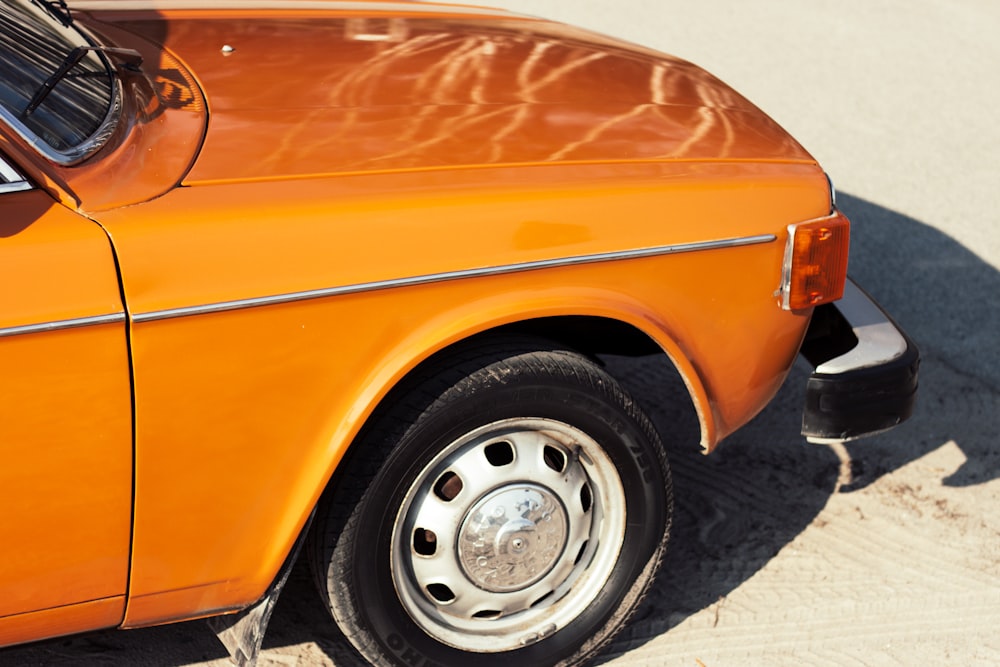 orange car with white wheel