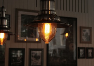Cozy living room illuminated by a warm pendant light from lichtlux