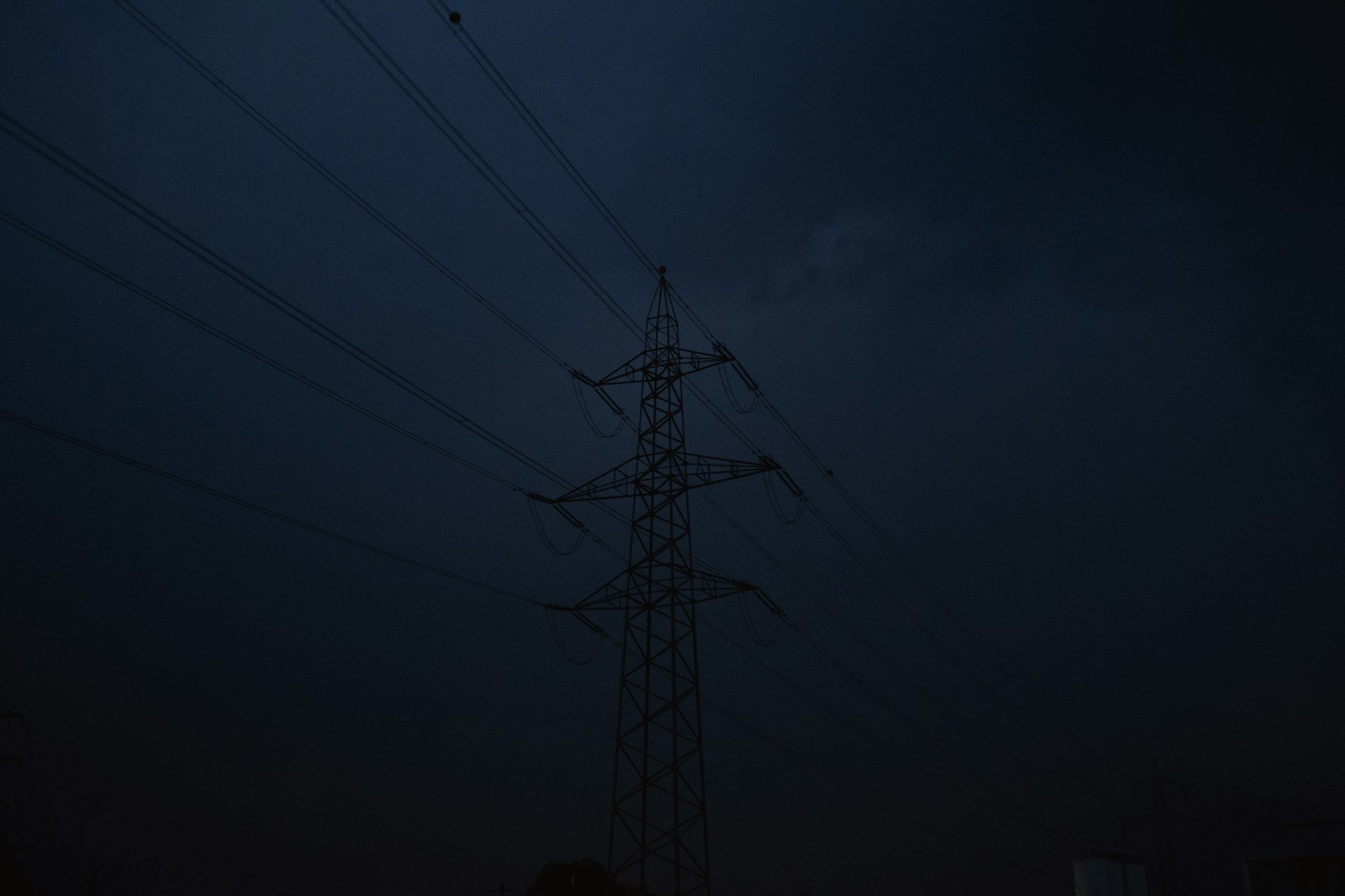 black electric tower under dark sky