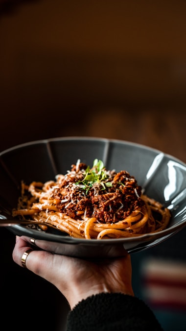 A plate of fresh pasta with marinara sauce and basil, Italian restaurant in Waco