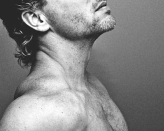 topless man with black and white hair