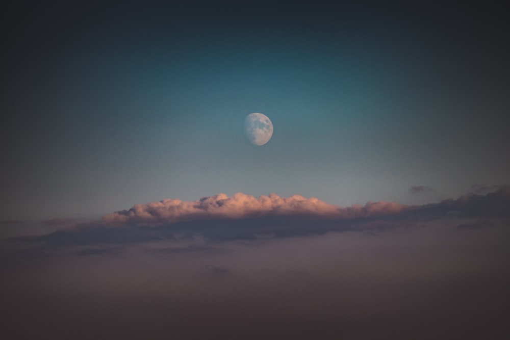 full moon over the clouds