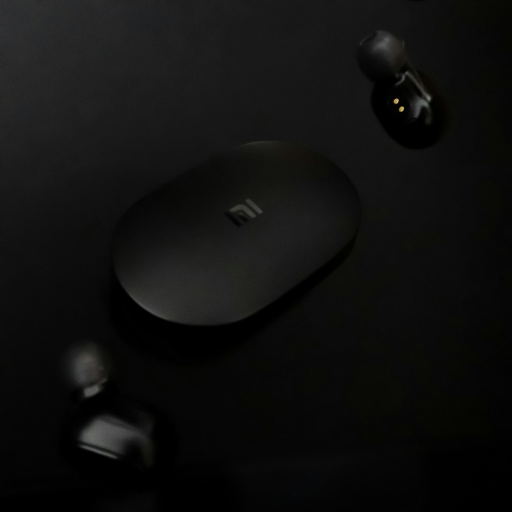 apple magic mouse on black surface