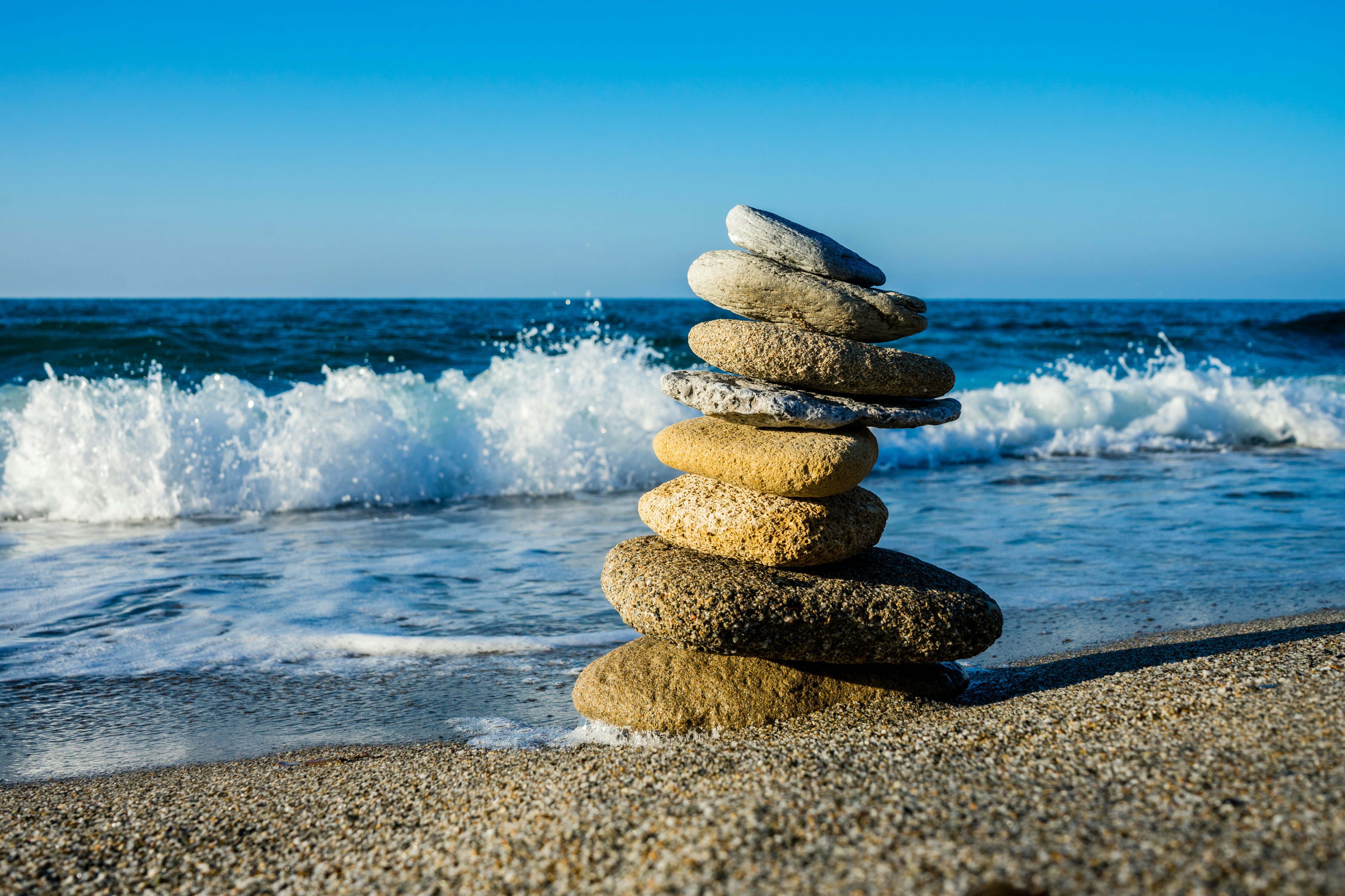 stack of stones on beach during daytime