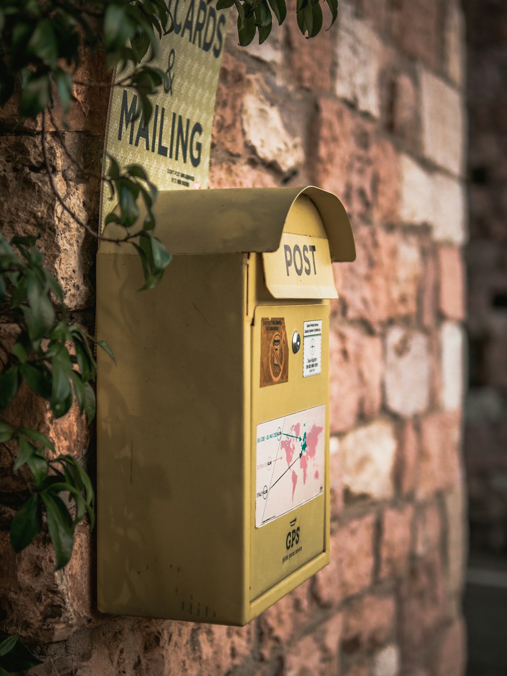 yellow and white mail box
