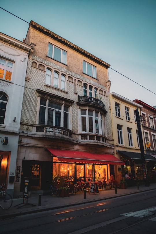 white and brown concrete building during daytime in Ghent Belgium