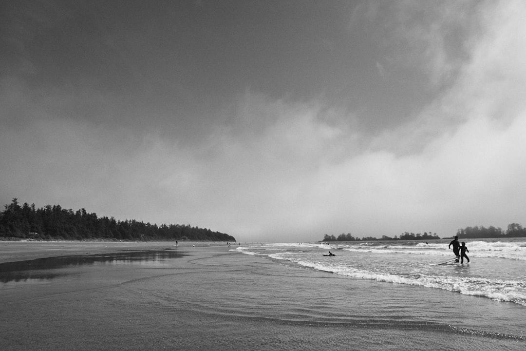 grayscale photo of sea waves crashing on shore