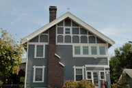 brown brick house with white wooden door
